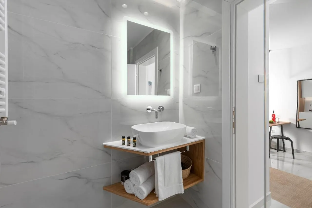 Apartment Ιωκα Suites / The Urbitality Project Thessaloniki Greece
